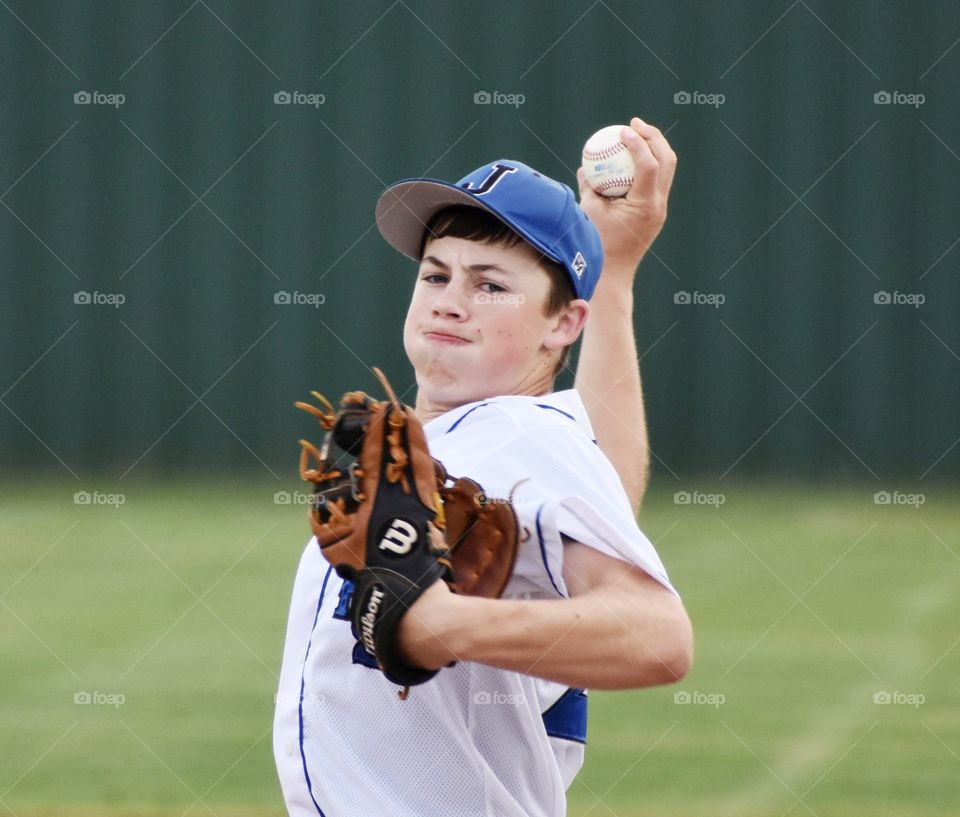 Baseball pitcher throwing ball