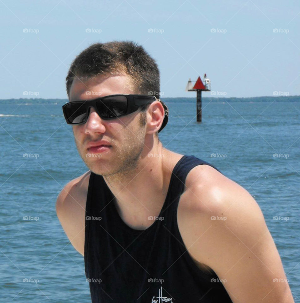 Badass. sultry teenager aboard fishing boat soaking up sun rays