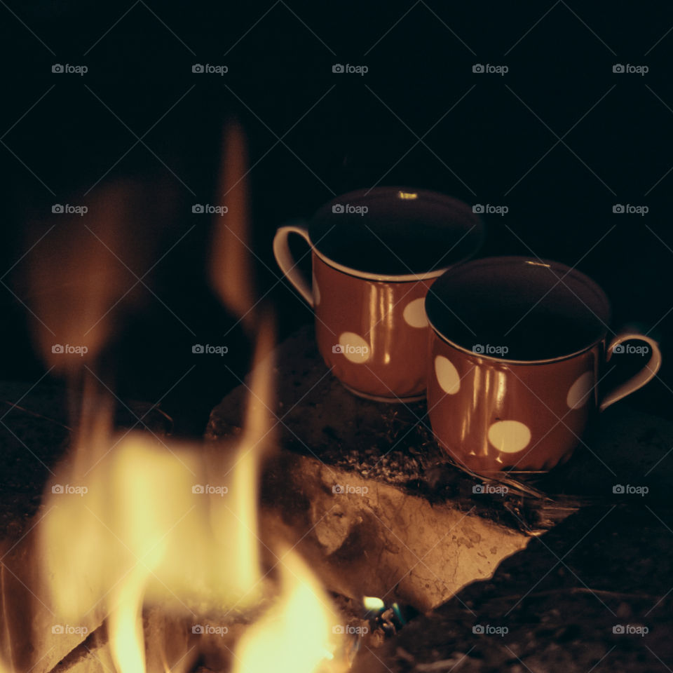 two cups of tea around the campfire