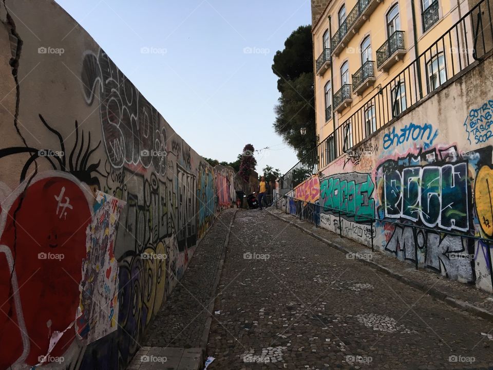 Lisbon’s colourful side of street view. Still in darkness