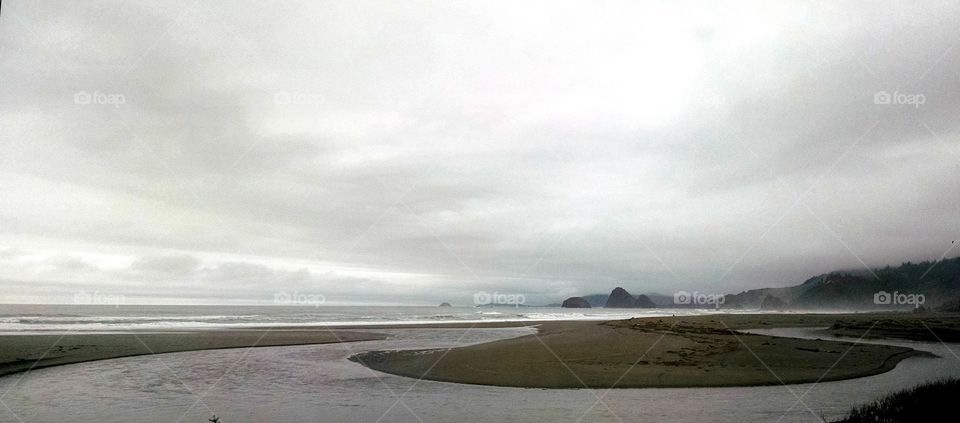 an overcast beach and coastline