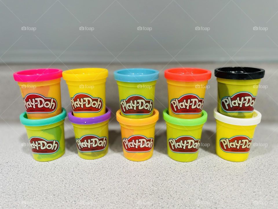 Color explosion of playdoh, lining up cans of playdoh, making a picture of the lids of playdoh, rainbow of colors in playdoh