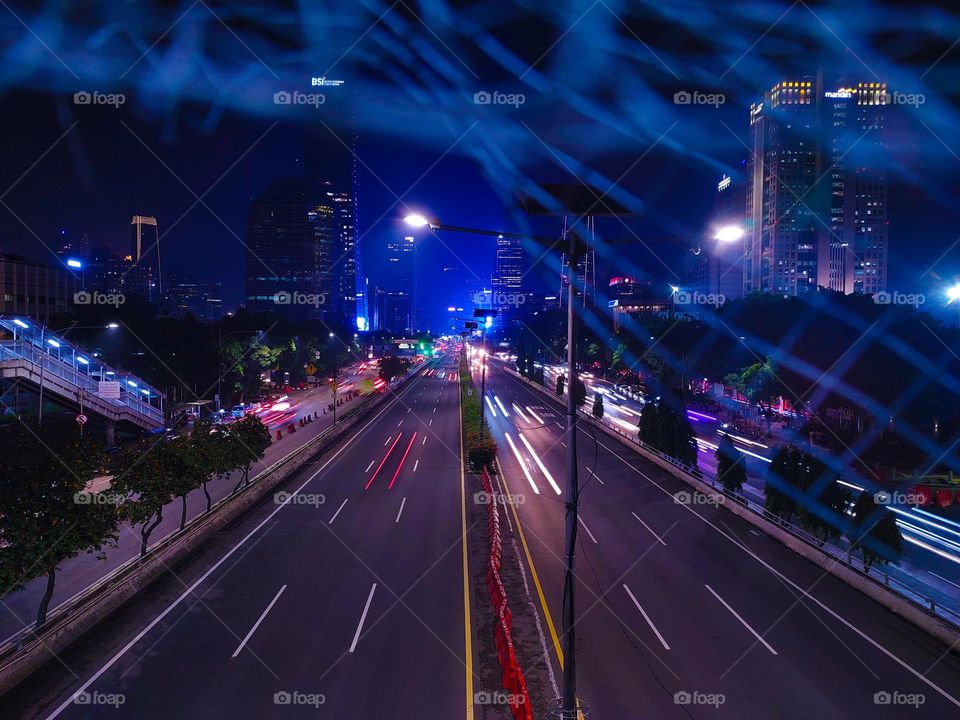 traffic lights in the city of Jakarta at night.