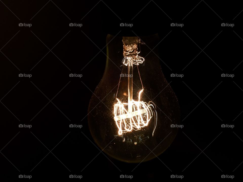 Close-up of light bulb at night