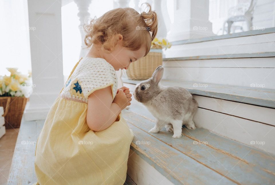 Small girl with rabbit