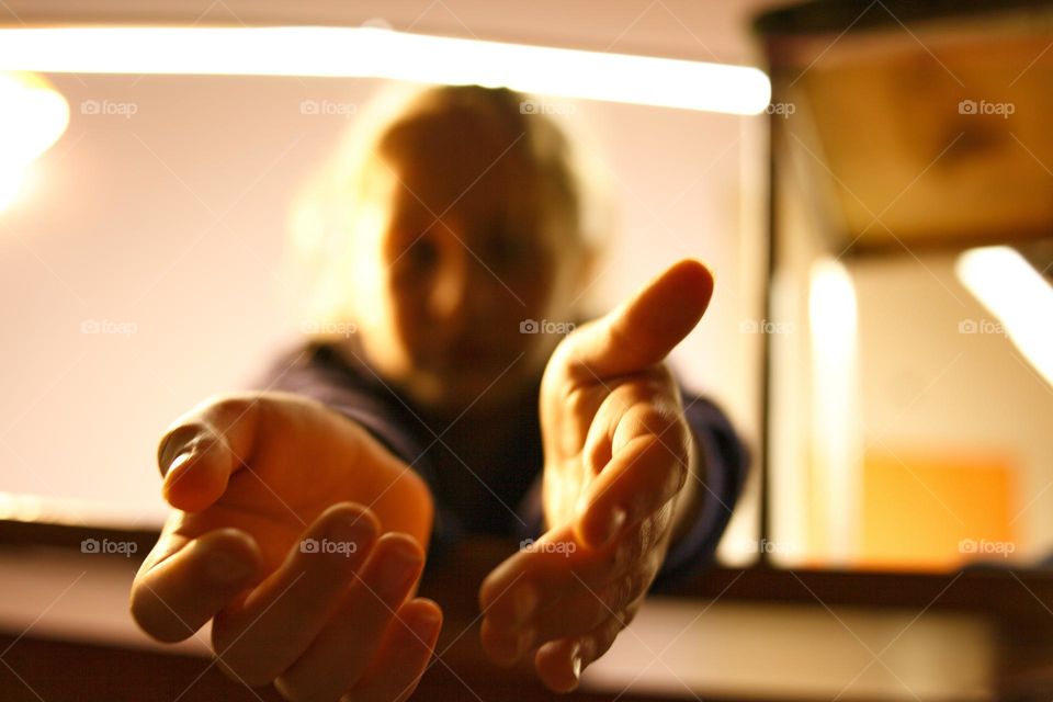 girl stretches her hands to the camera close-up of her hand