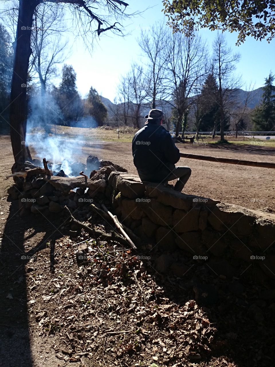 Man next to fire on the mountain