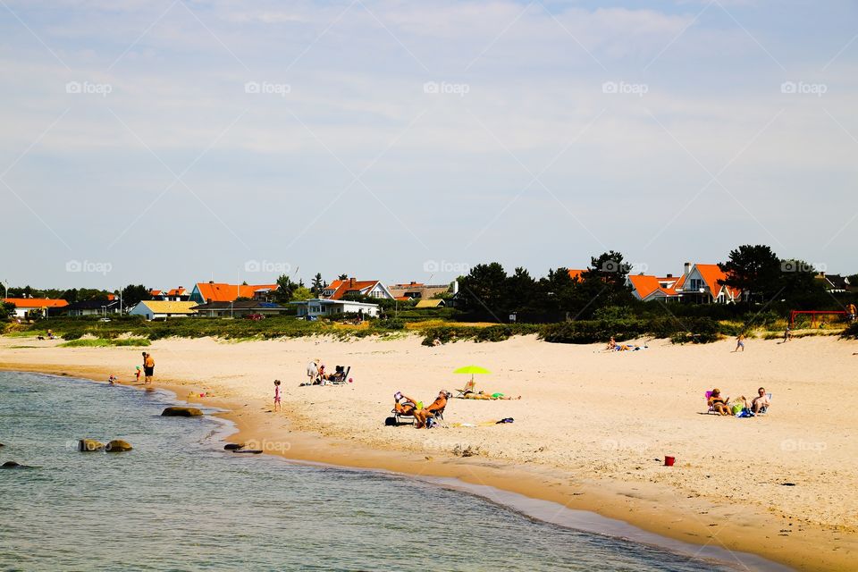 Having a great day by the beach. Having a great day in the sun on the sandy beach