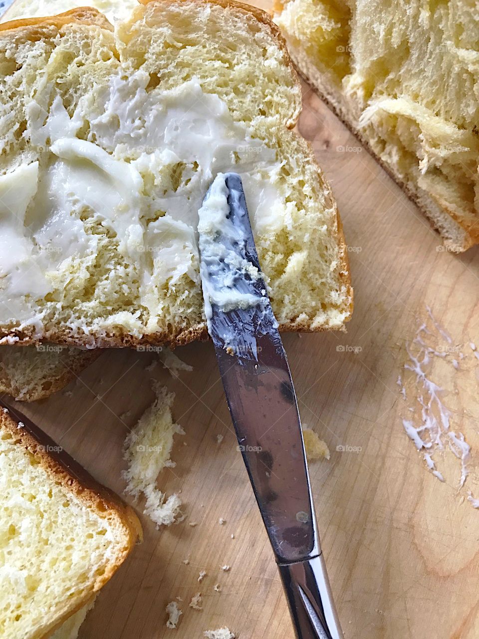 Buttering bread with copy space
