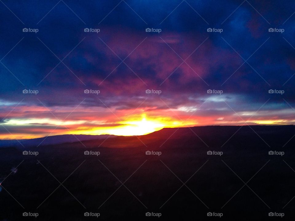 Sunrise over Grand Mesa 2. On a flight out of Grand Junction. Colorado.