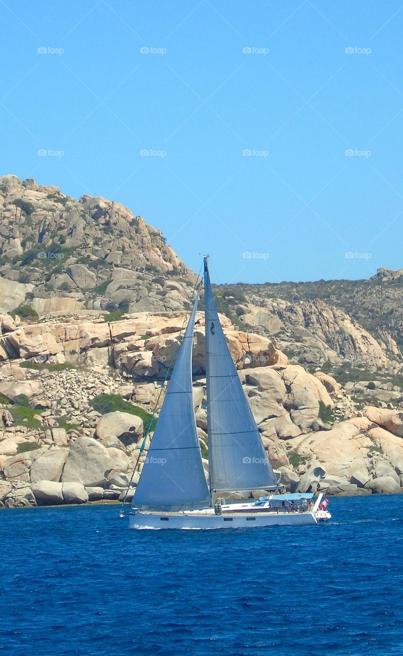 sailboat in mediteranean sea in sardinia