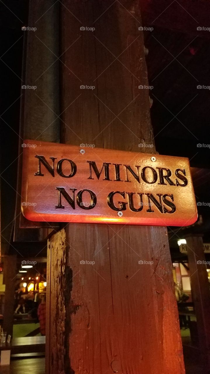 sign at bar in Seattle. no minors, no guns