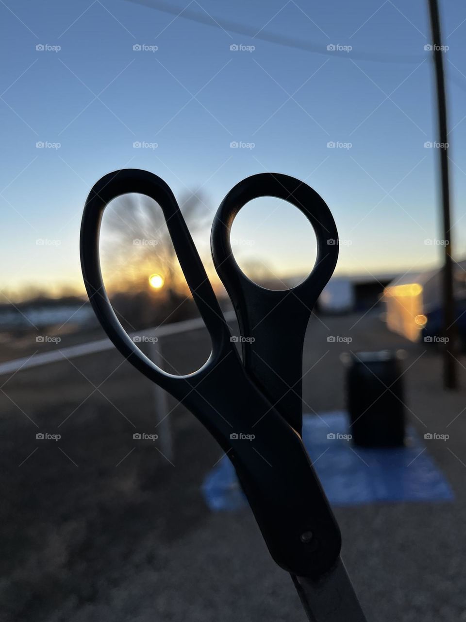 Scissors framing a sunset