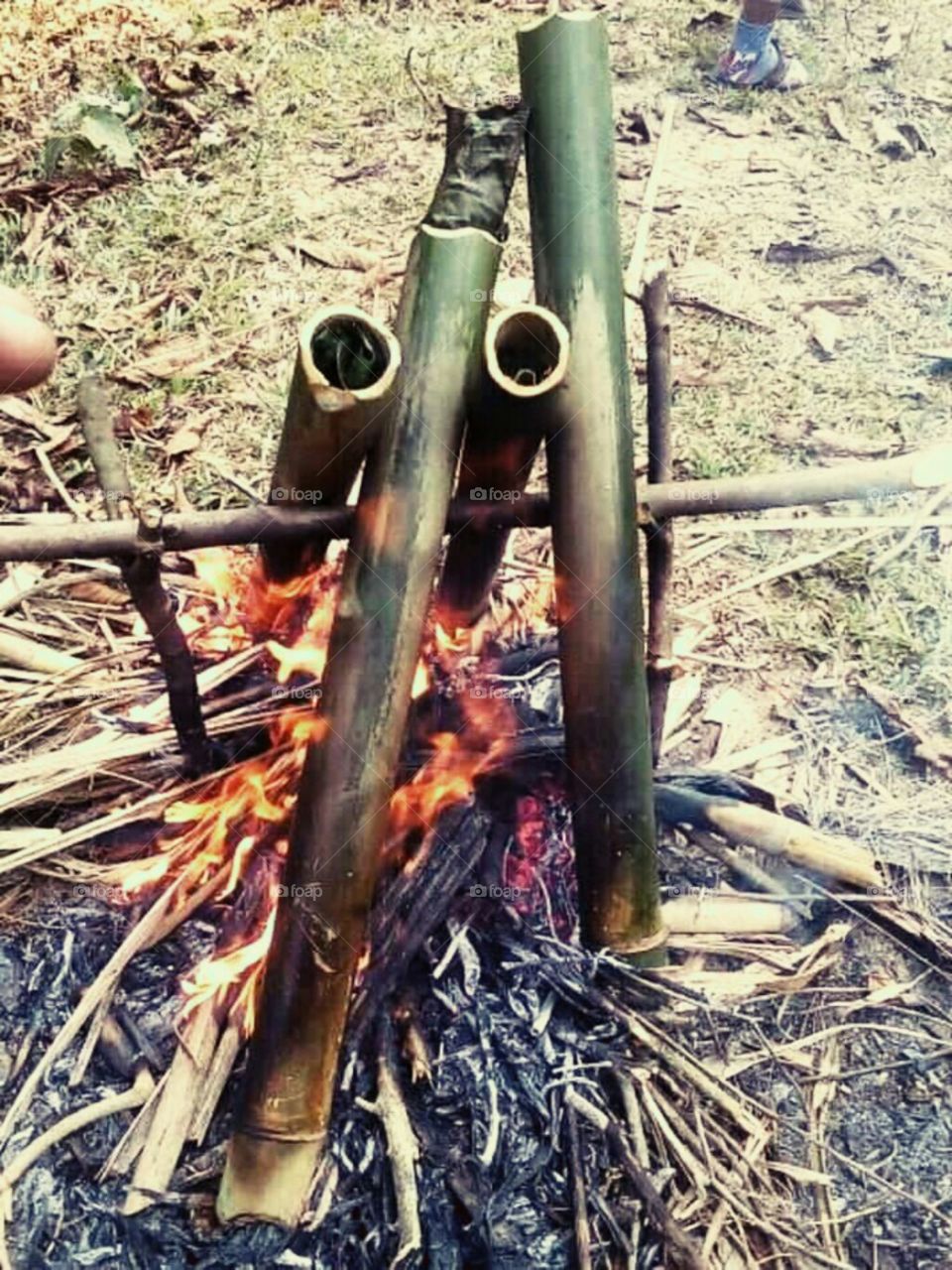 Cooking by  bamboo with fire