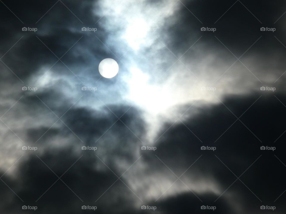 Sun between clouds