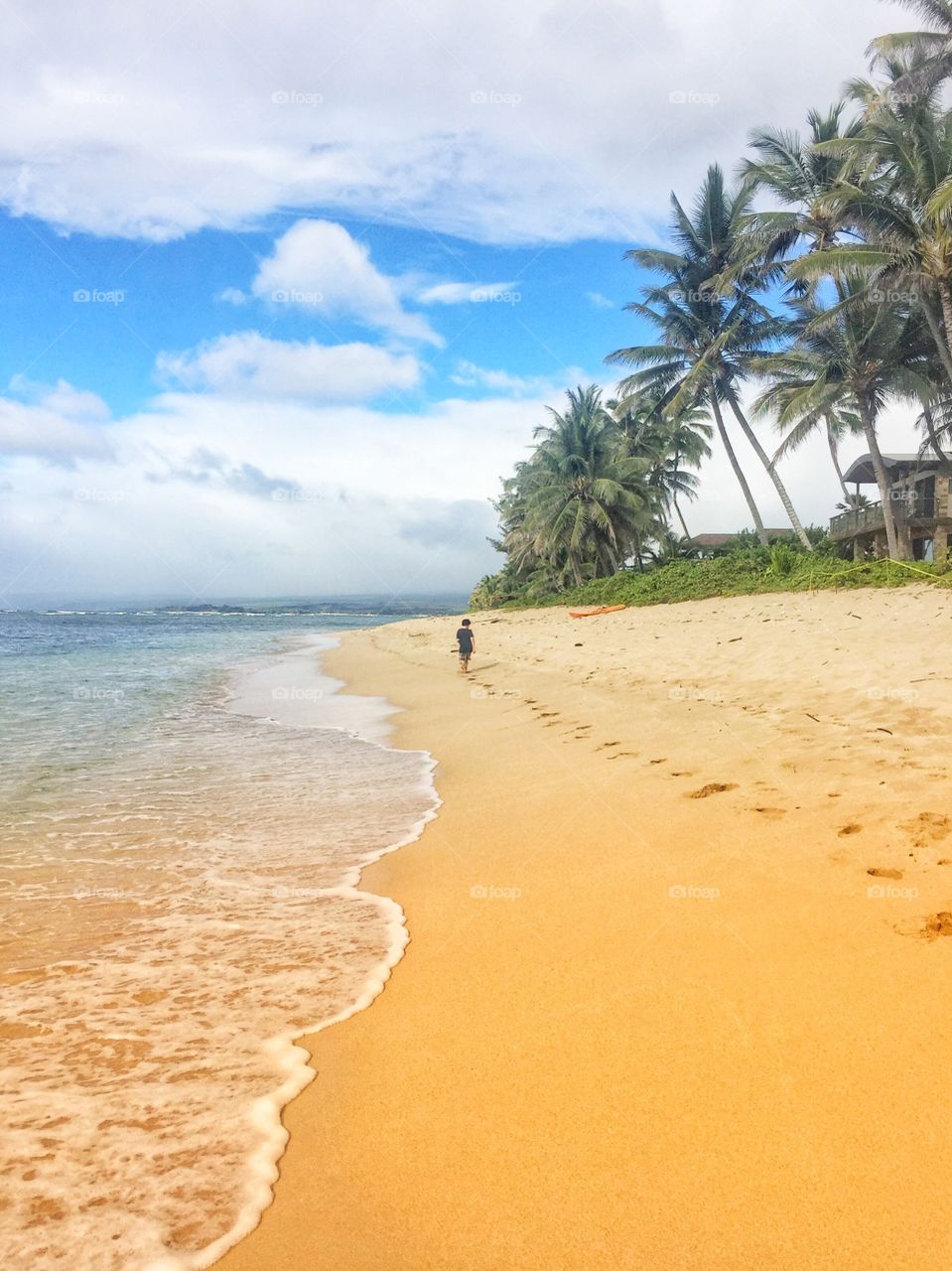Running along the beach in Waialua, Hawaii