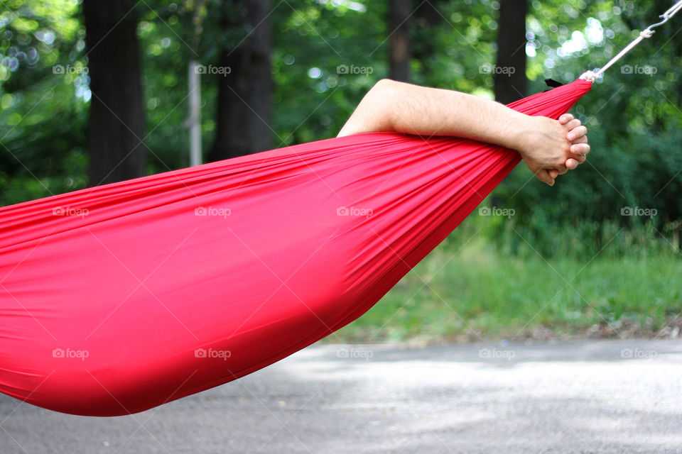 Relaxing in a red hammock