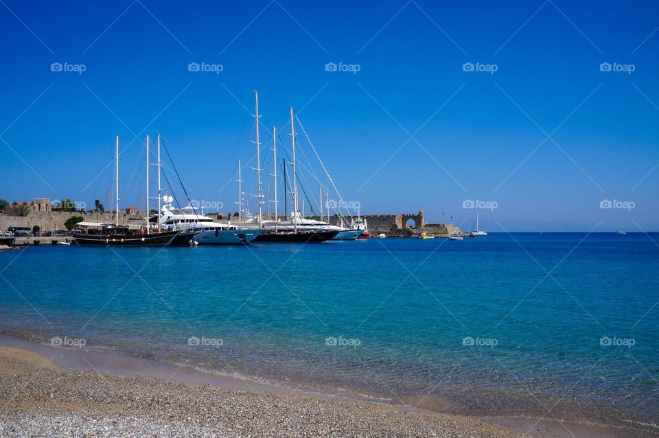 White boats docked on the Mediterranean beach