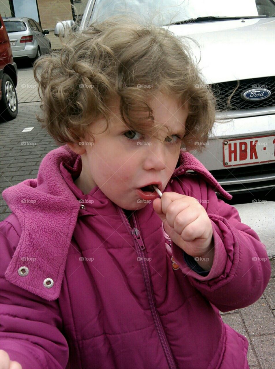 My cute daughter with a lollipop