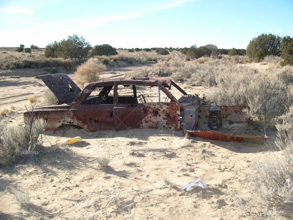 Abandoned vehicle in the desert. 