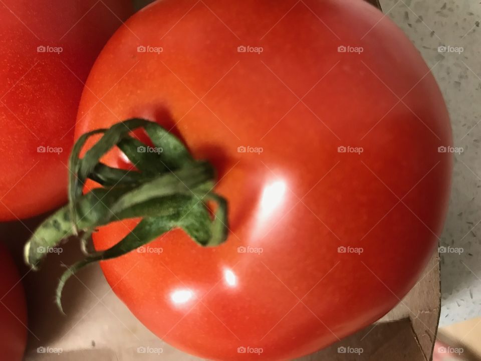 Full red tomato close up