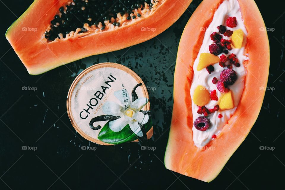 Papaya with yogurt, plus raspberries and mango.