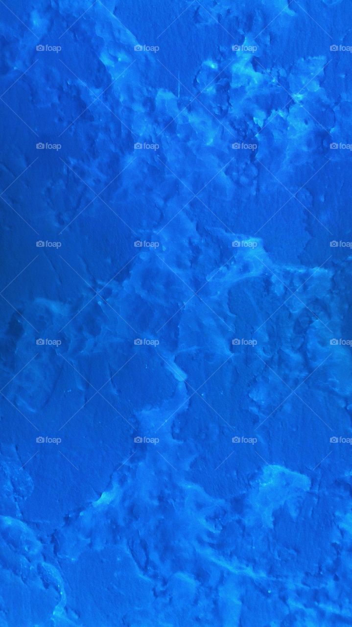 Blue bright wall stone texture that can 
be use as a beautiful wallpaper design