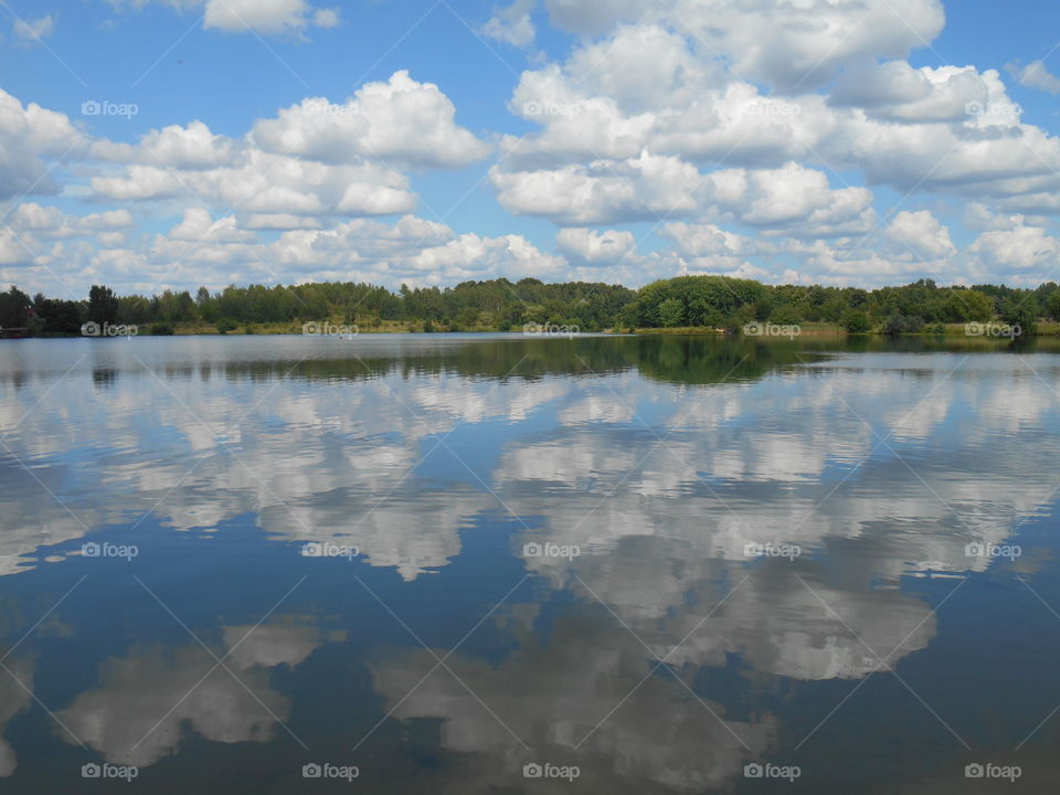 Reflection of clouds in river