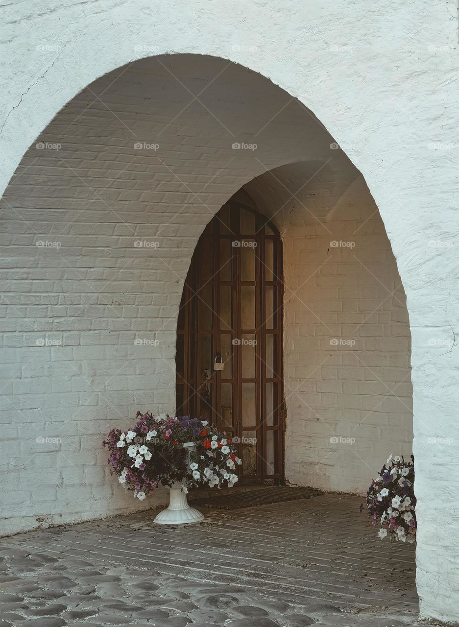 An arch in an old brick wall