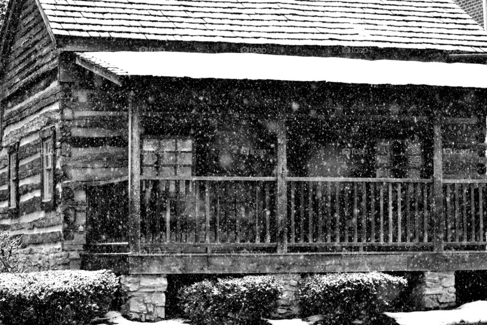 snowy log cabin