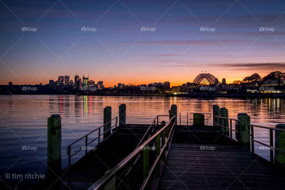 Standing on the Darling Island Ferry Wharf, I wait for the sun to peek over the horizon. The buildings centre left are North Sydney and the Sydney Harbour Bridge is on the right