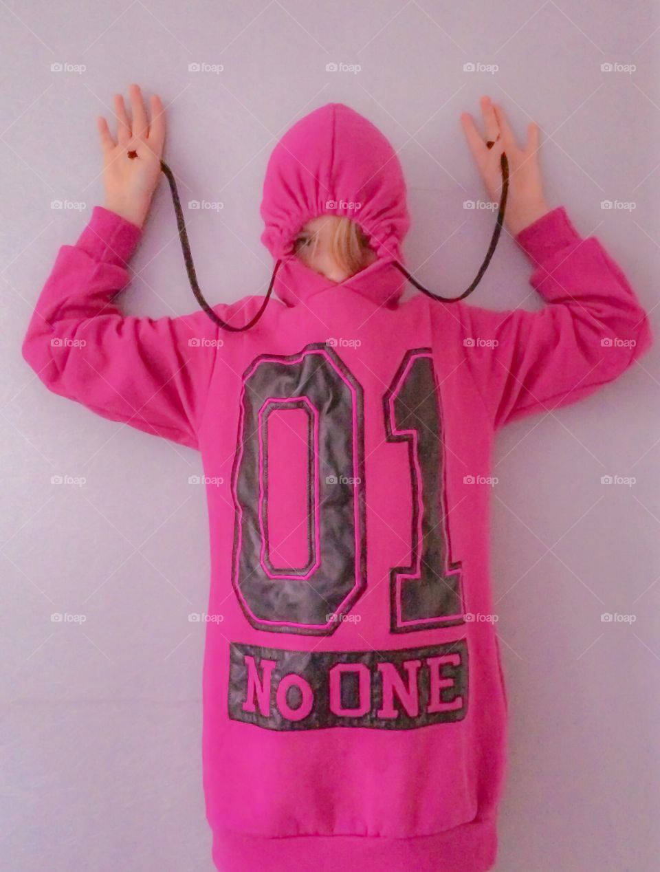 Pink. Girl in a pink hoodie