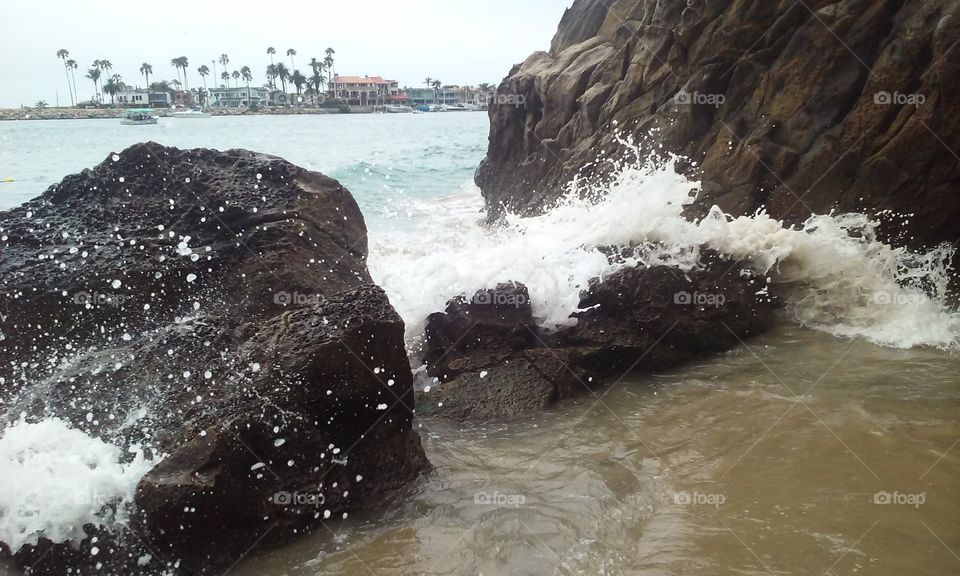 crashing waves. high tide in pirate's cove