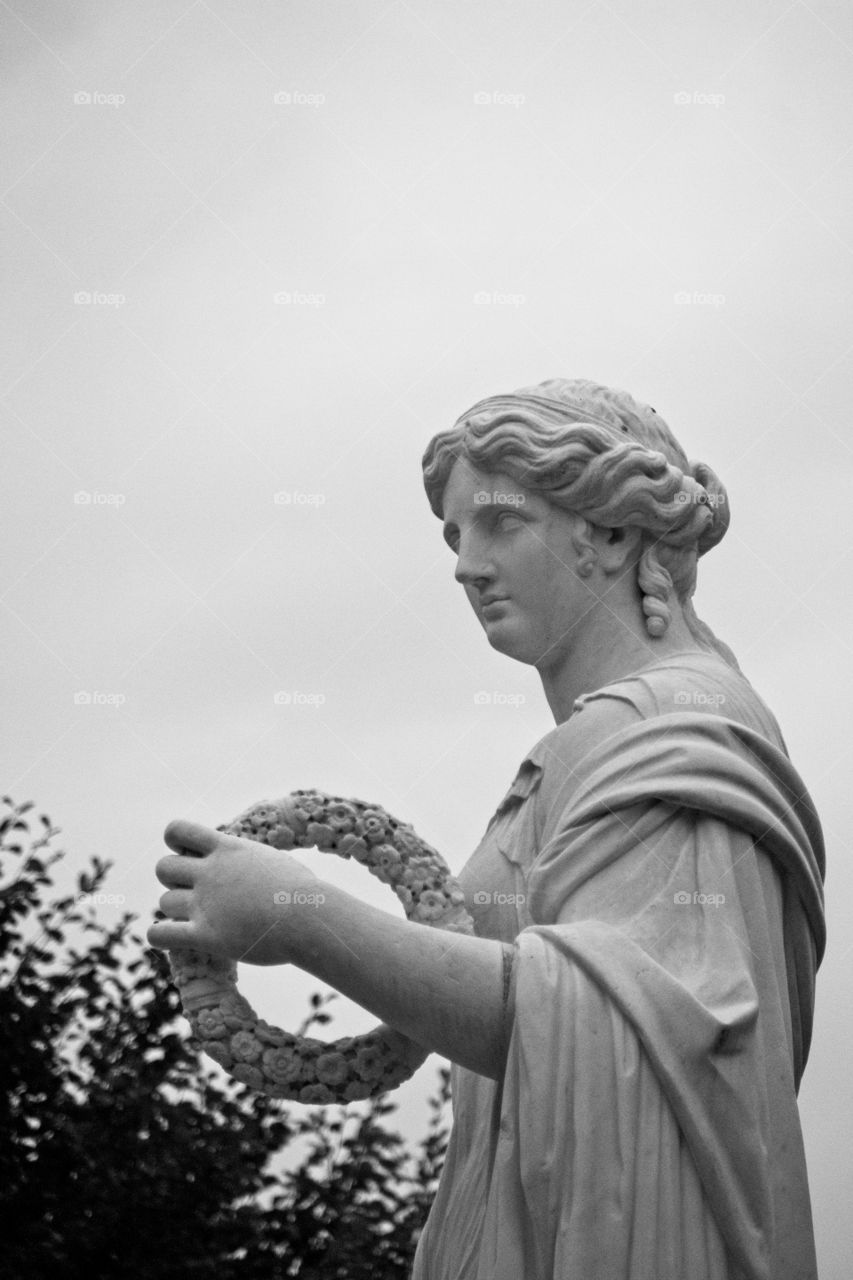 statue of a person in a garden