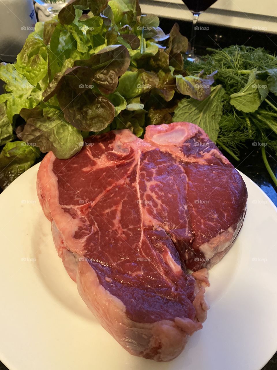 Raw meat on a plate- T-Bone