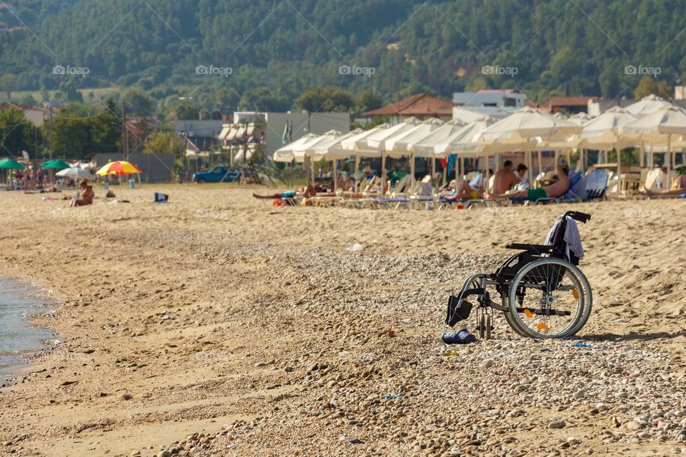 A wheelchair at a public beach in Greece