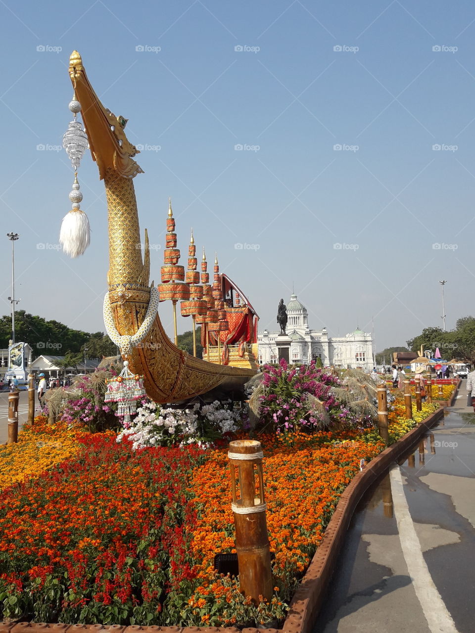 five tiered umbrella of kingship  , pavillion for the king and his immidiate royal family on the "Royal Barge Suphannahong Model" with beautiful flower arrangement.