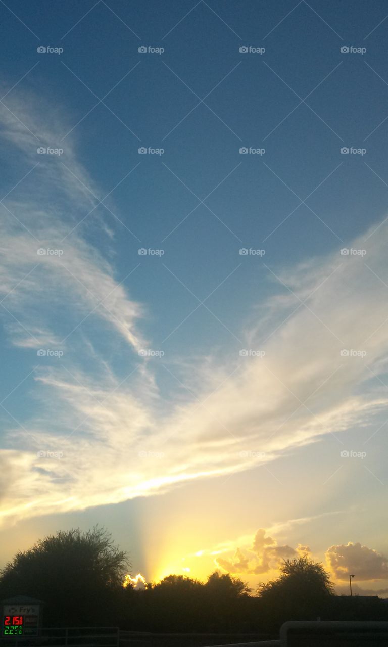 Wow , look at what i see
Up in sky, right in front
Of me. A feathery looking
Angel, up above in the cloudy
Sky. Up above really High.
Beyond in the background,
Is a Stormy looking sky.
The Sun is setting , with a
Fiery looking orange glow.
What a Magnificent site,
For sure to see, How blessed
Am I, to see this beautiful
Amazing Sun setting Sky.