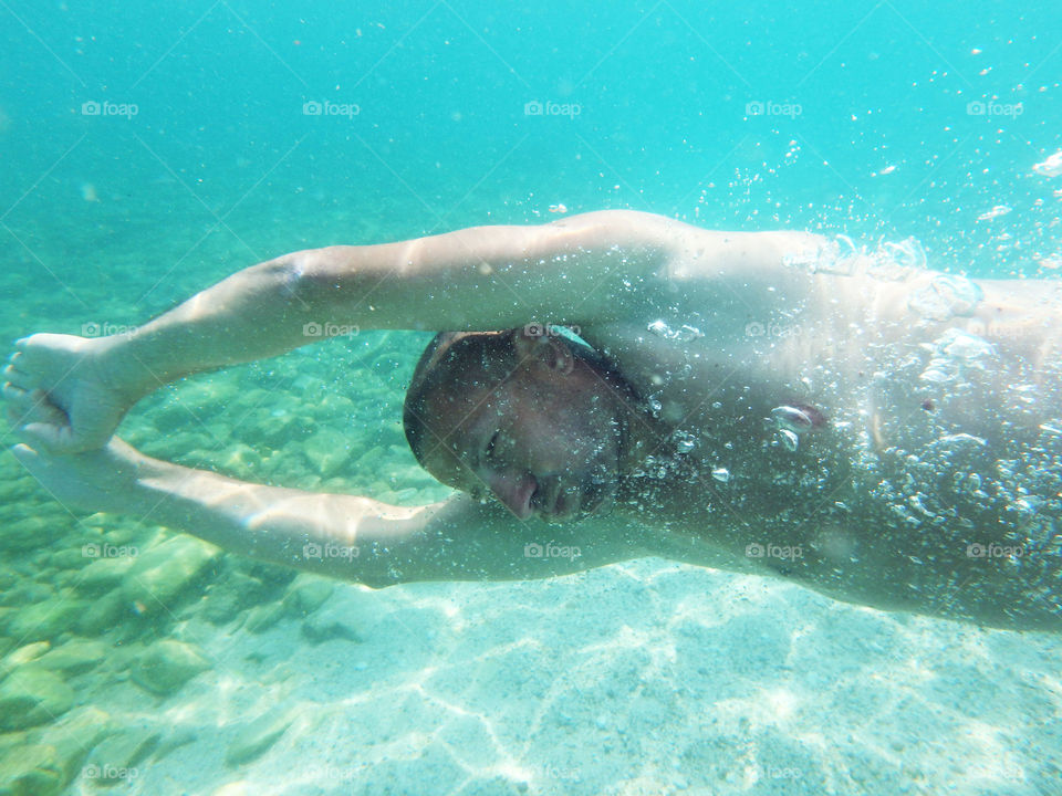 man diving. man diver diving in the sea