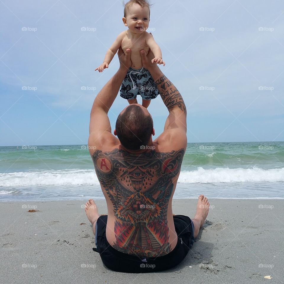daddy and son. day at the beach
