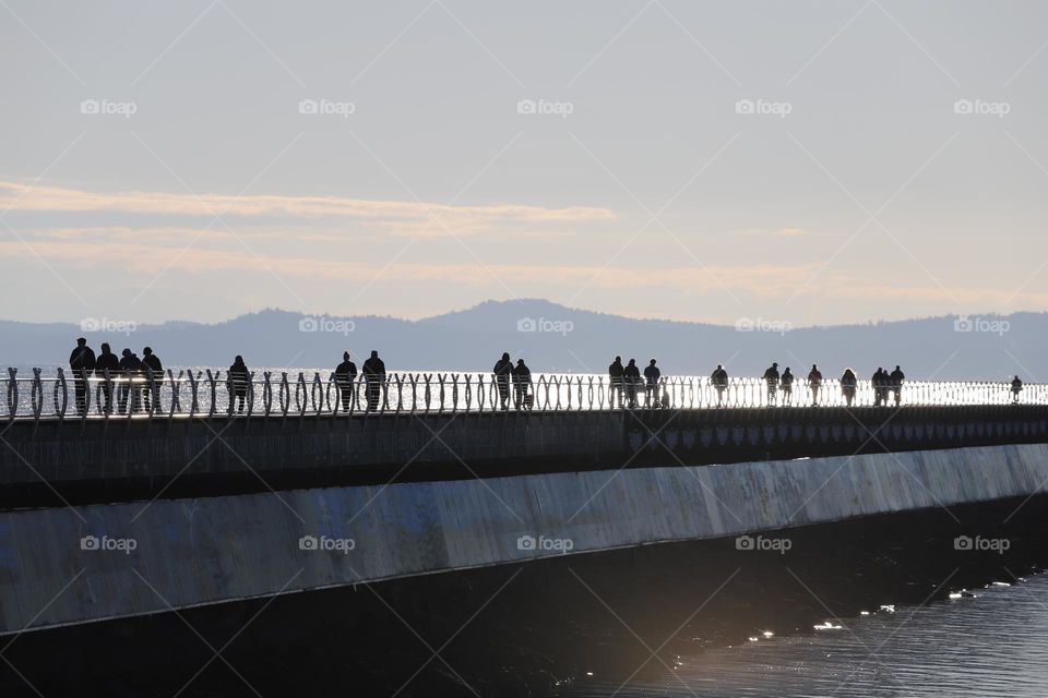 People on breakwater 