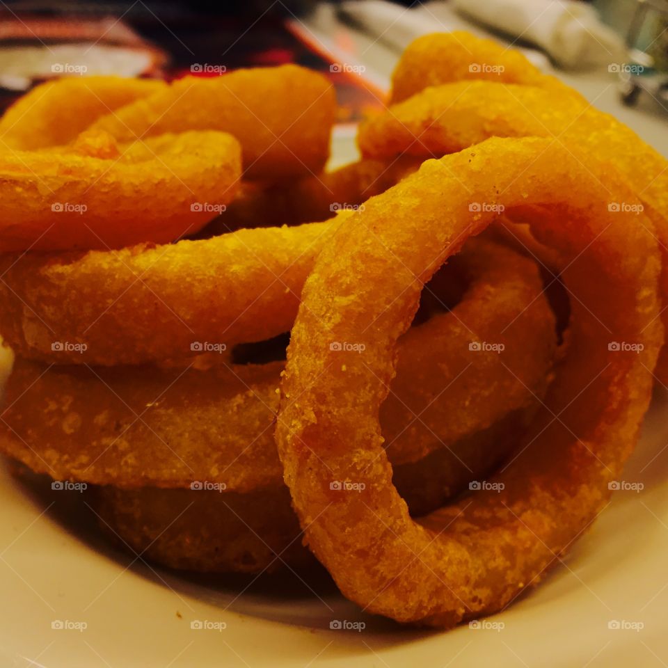 "Steak N'Shake's Onion Rings"

In this photo, I wanted to experiment with taking pictures of food. Here I emphasized the color and texture of the onion rings