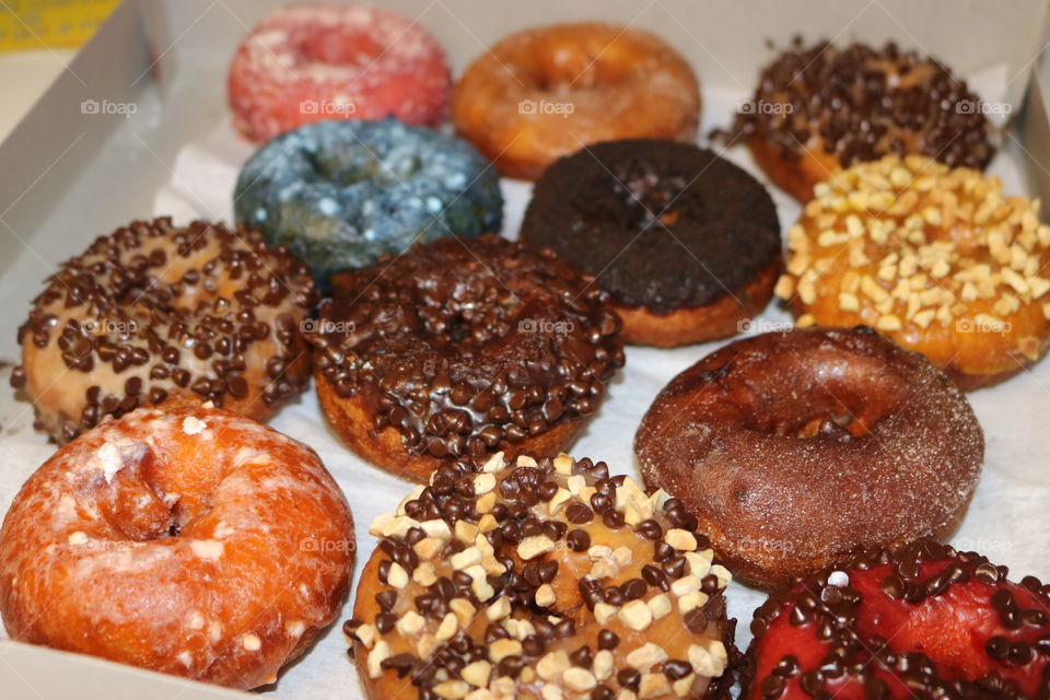 Assortment of donuts for dessert- chocolate, blueberry,strawberry, glazed, nuts, cake, chocolate chip! Yummy!! 