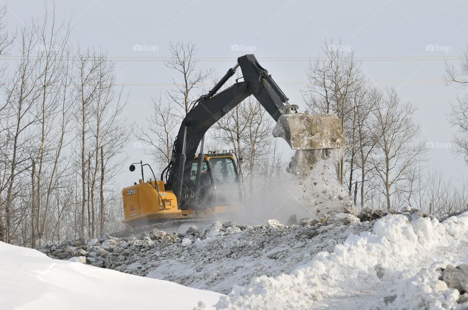 excavator on winter worksite