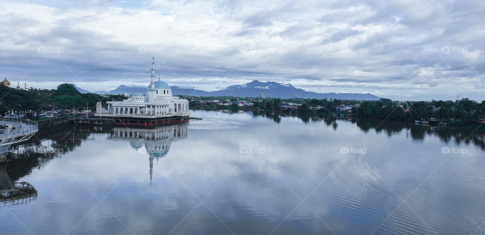 Nice scenery at Sarawak River, Malaysia with reflection on the water