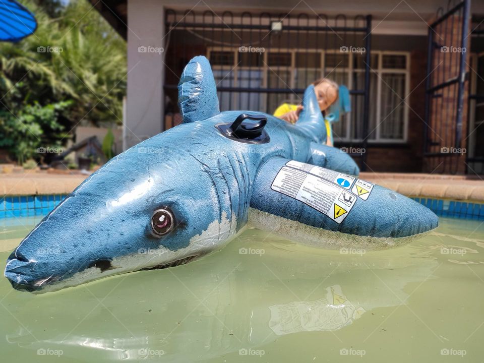 Shark ride-on inflatable pool float