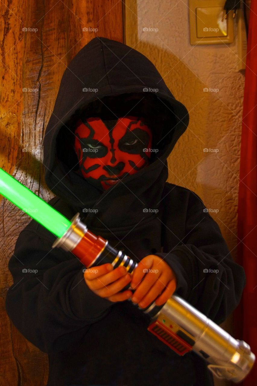 Kid masked as Darth Maul 