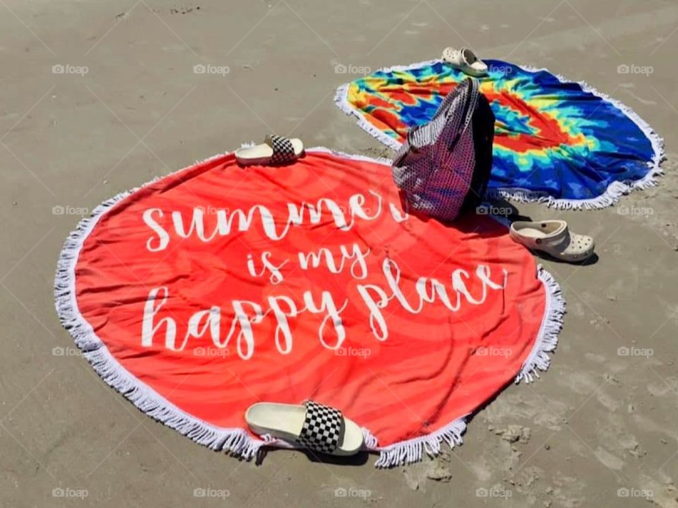 Summer is my happy place beach blanket spread out on sand with other items for a day at the beach