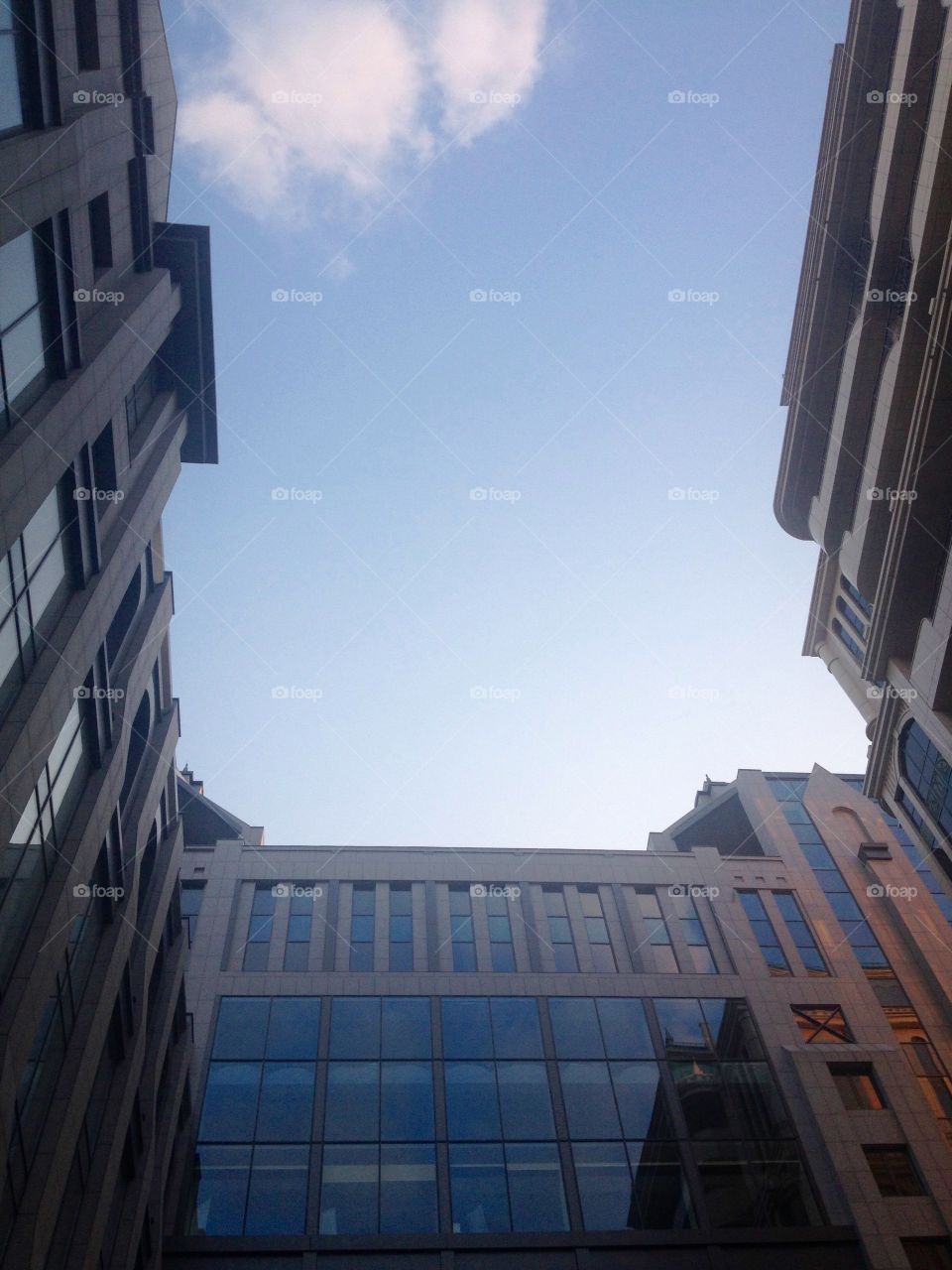 Sky between tops of modern houses 