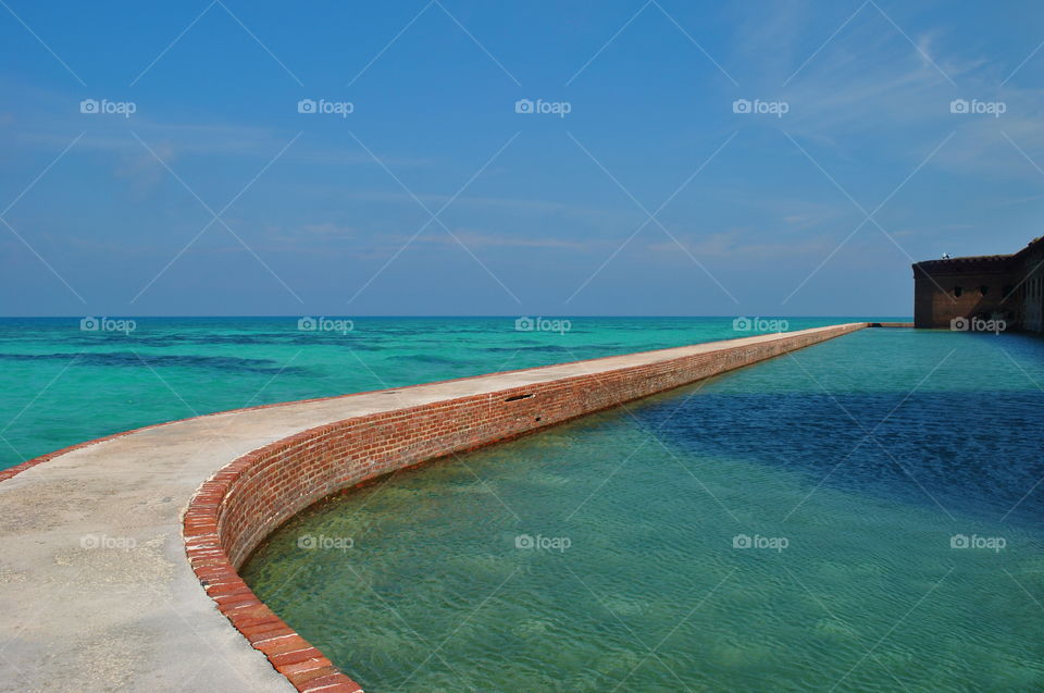 Dry Tortugas Nat'l Park. walking around the moat wall to circle the entire Fort Jefferson at the Garden Key, 70 km west of Key West, FL